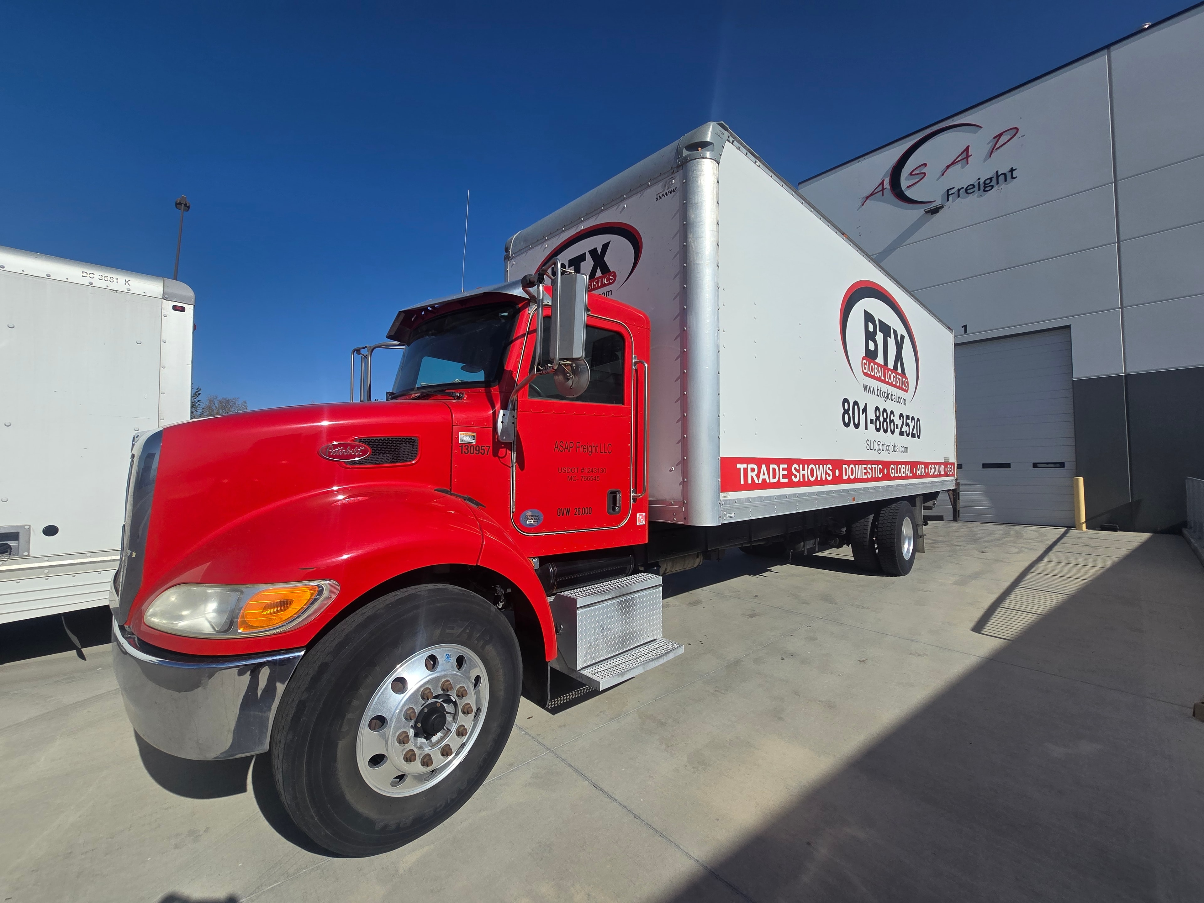 BTX Global Logistics box truck — front three-quarter view before decal removal