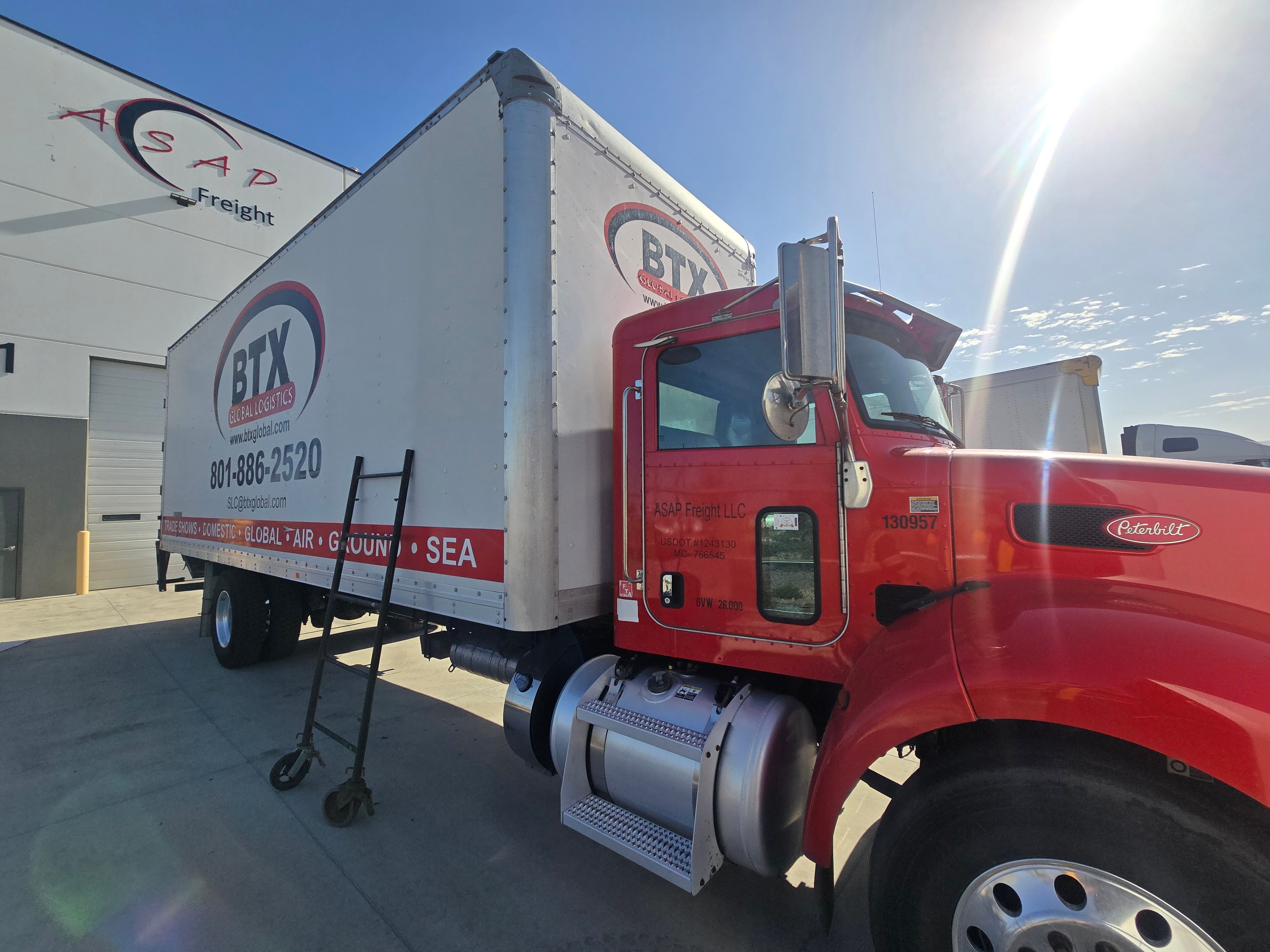 BTX Global Logistics Peterbilt — cab and box angle showing branding before fleet de-identification