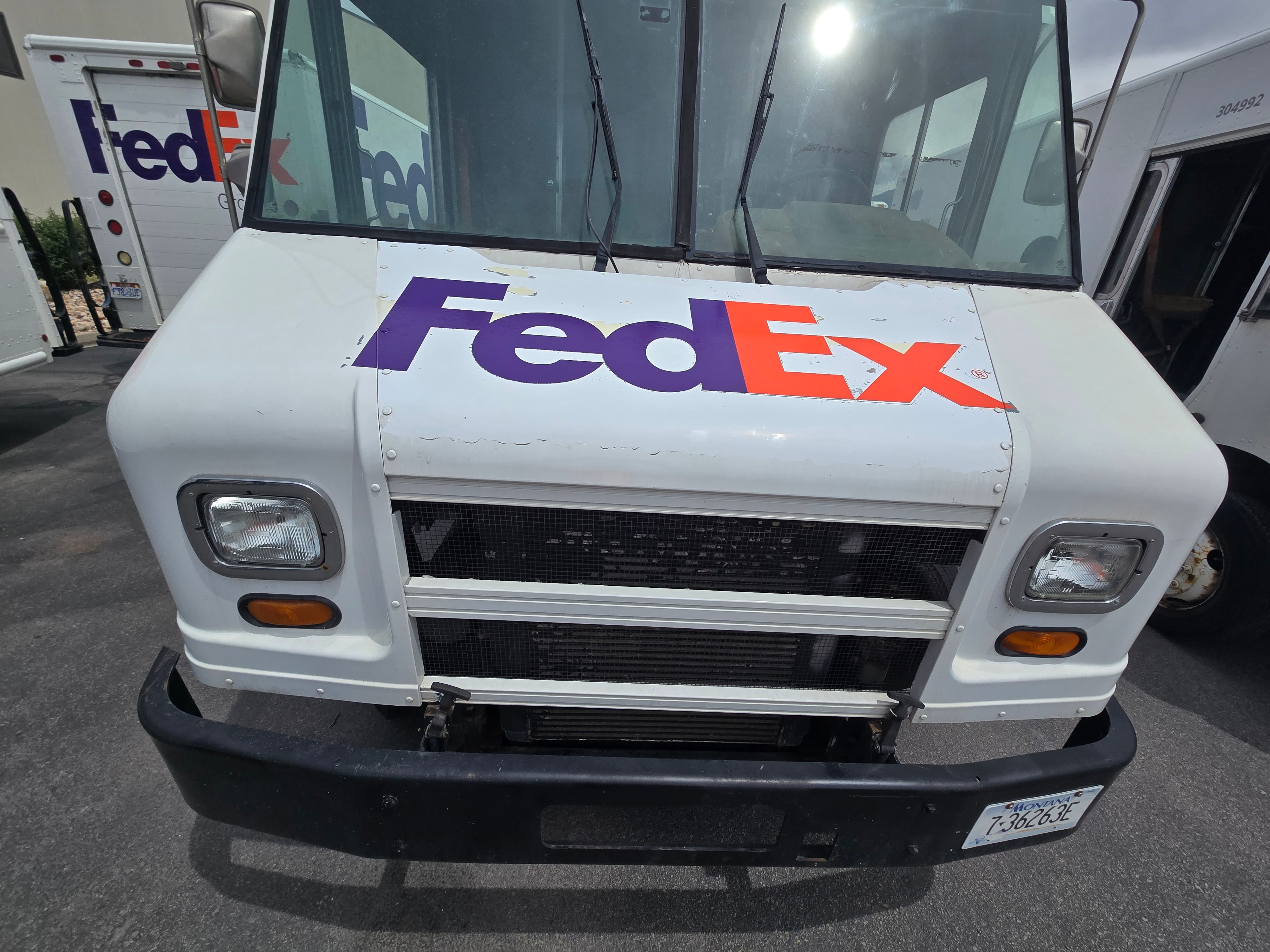 FedEx step van front face after decal removal — hood and cab clean after Utah fleet de-identification project