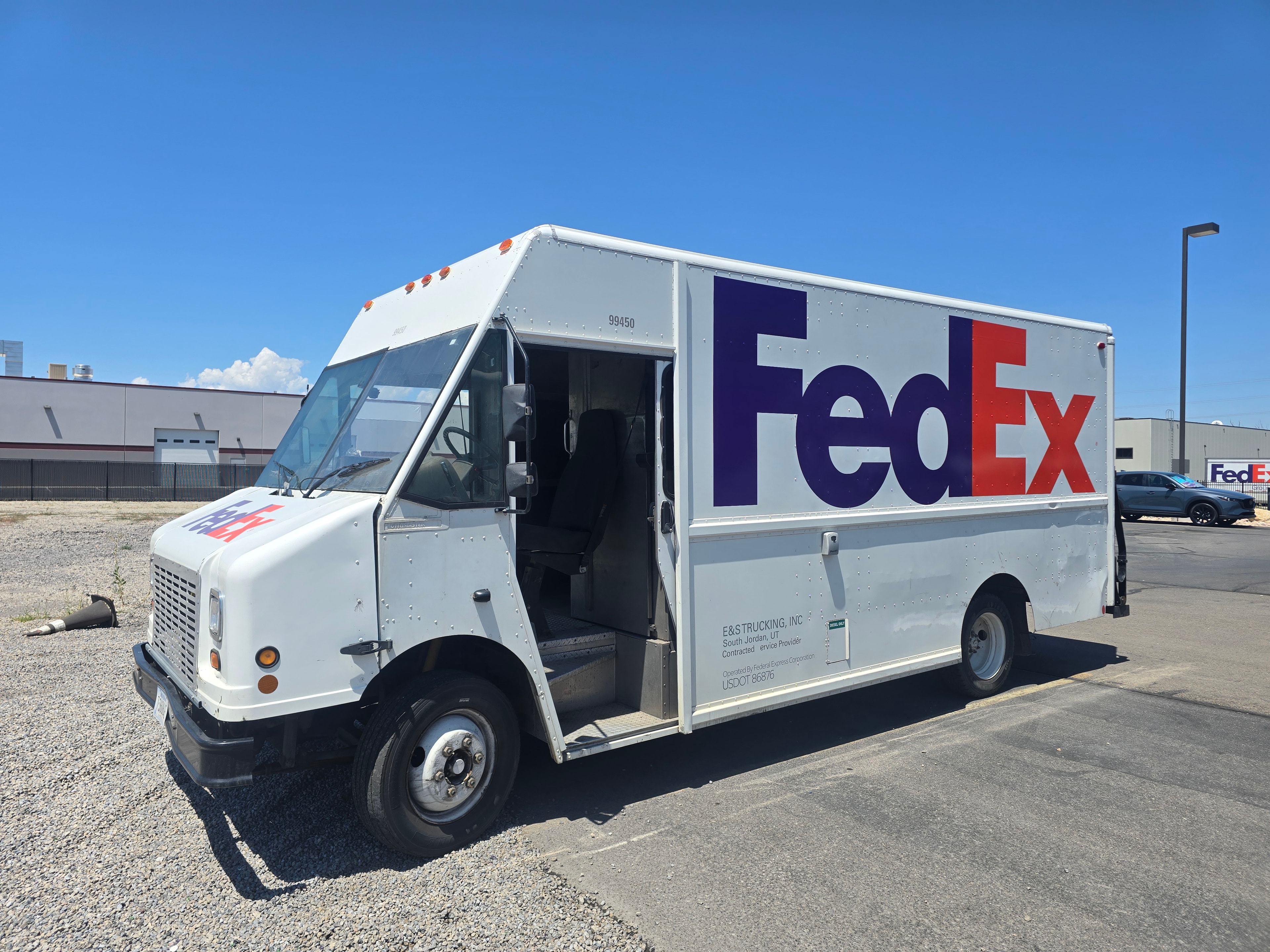 FedEx step van with door open after decal removal — side panel clean, ready for new branding, Utah