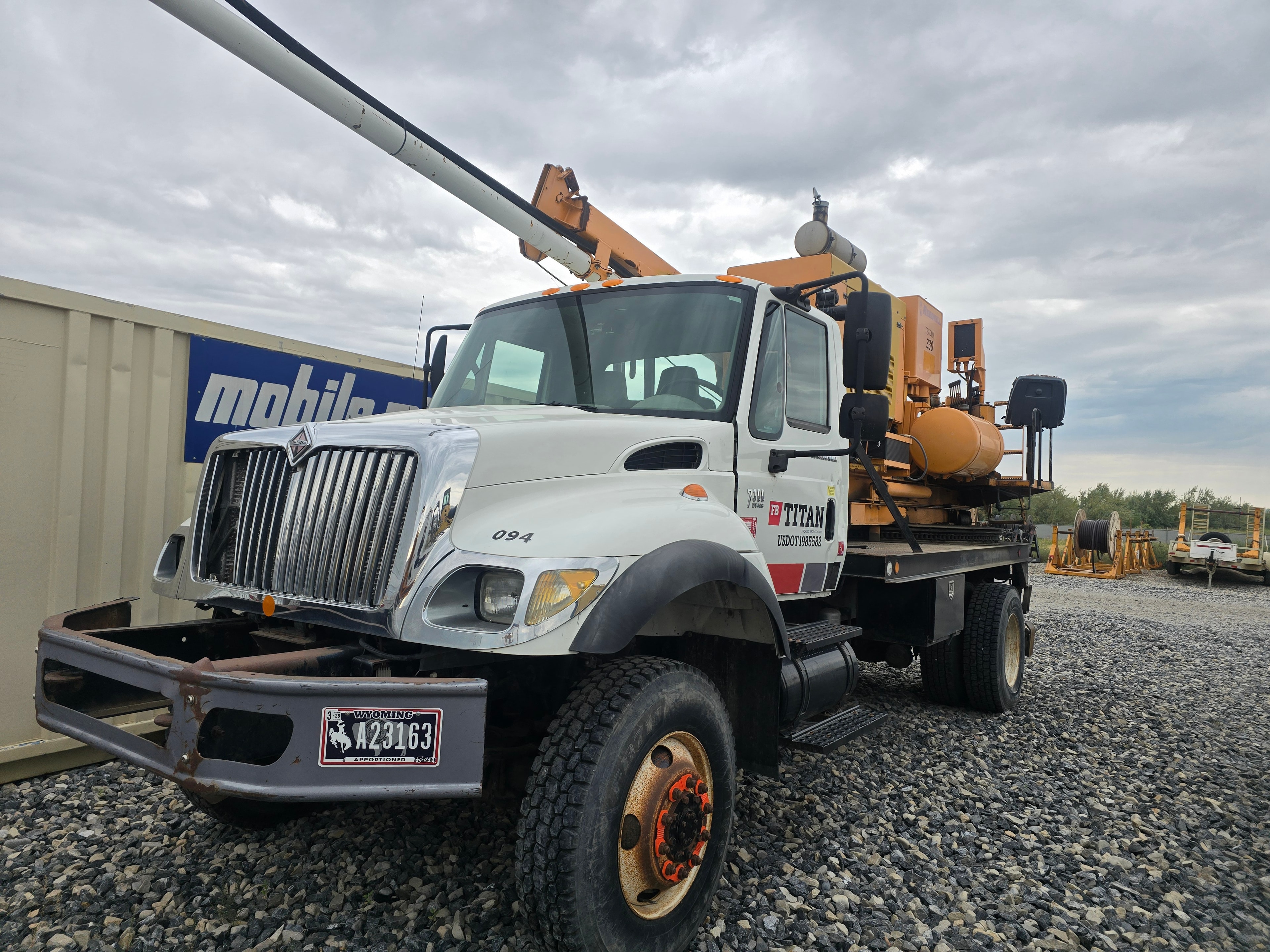 Titan International bucket truck 094 before washing — road grime and dust buildup