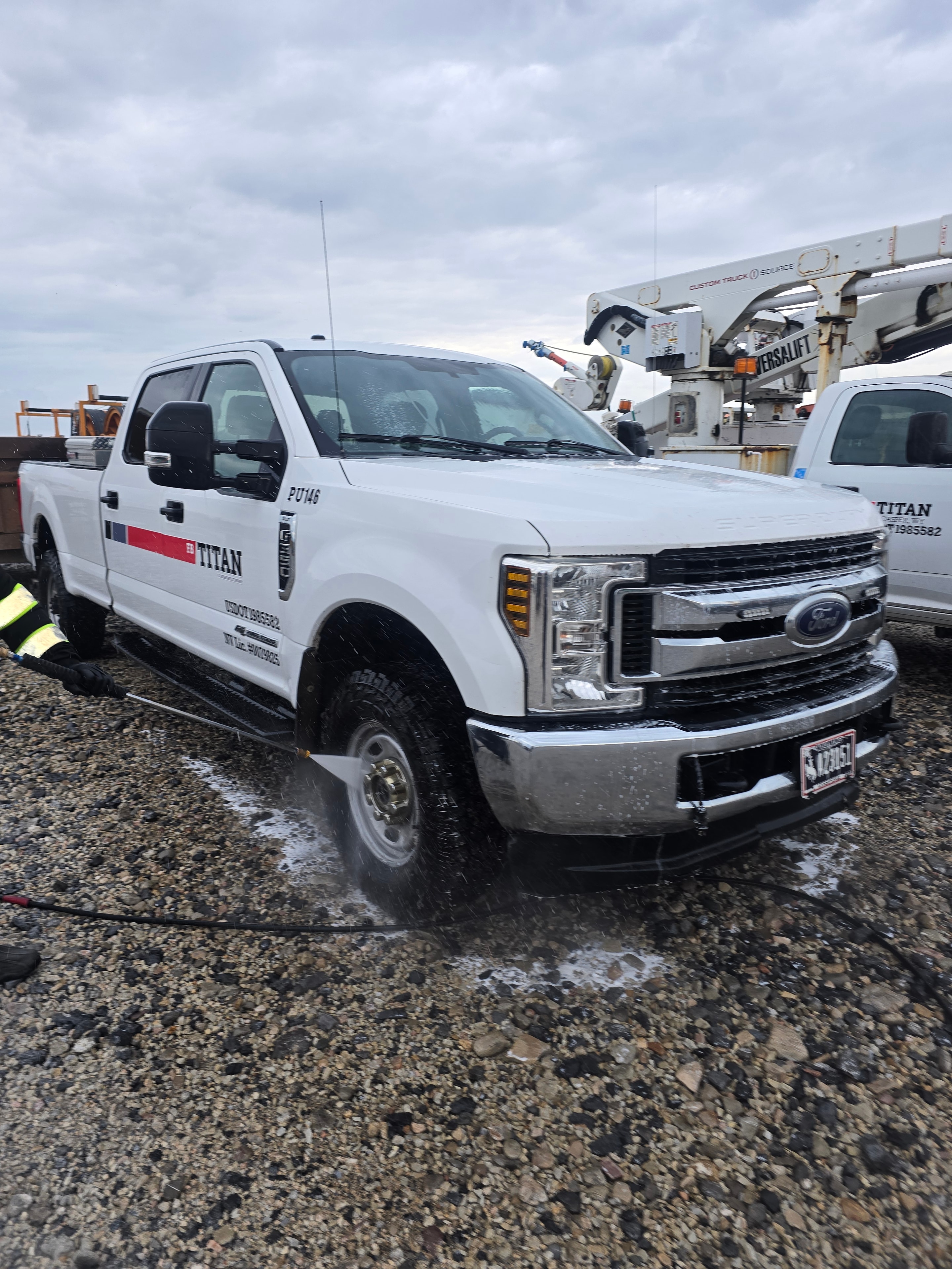 Power Stream USA washing Titan heavy equipment and utility trucks
