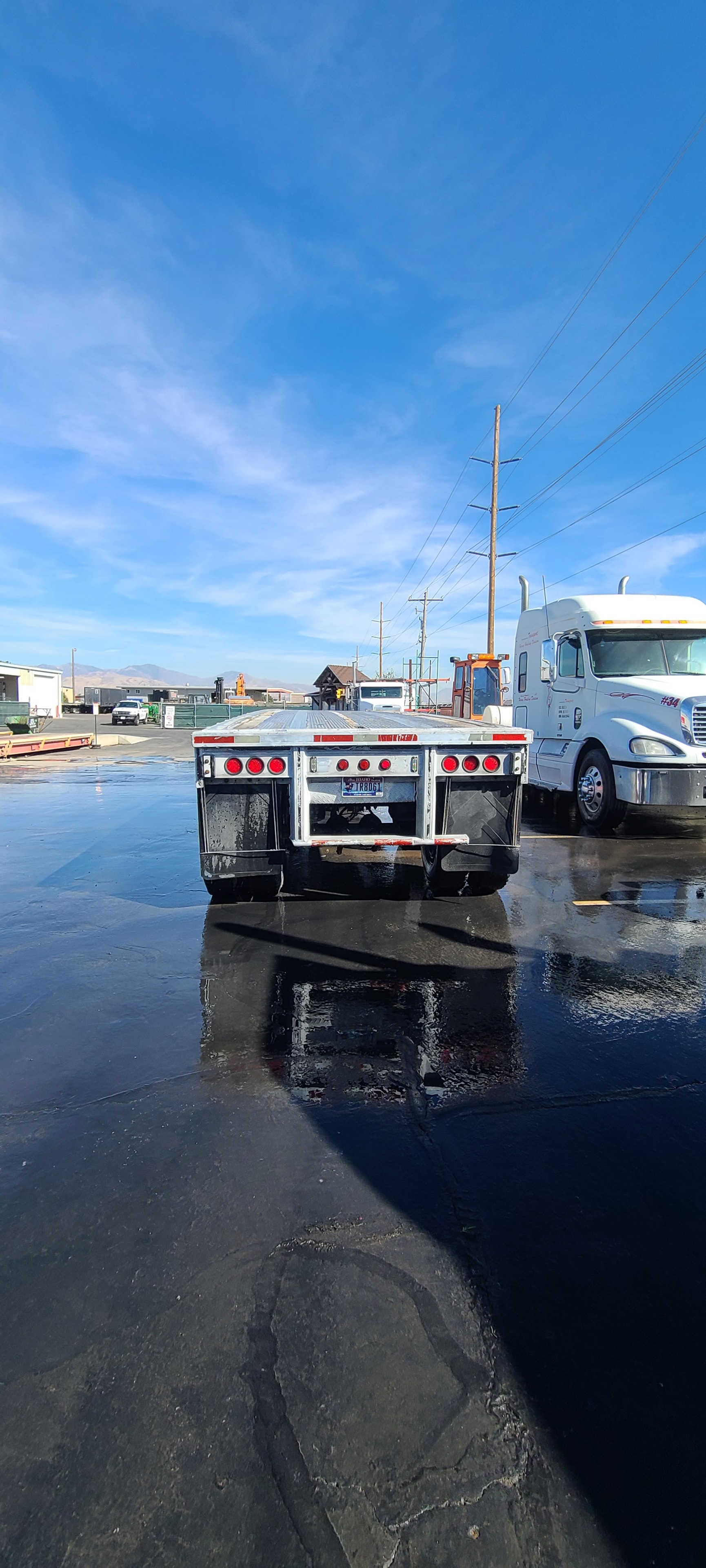 Wilson Transport flatbed trailer rear DOT lights — vivid and clean after washing, Salt Lake City