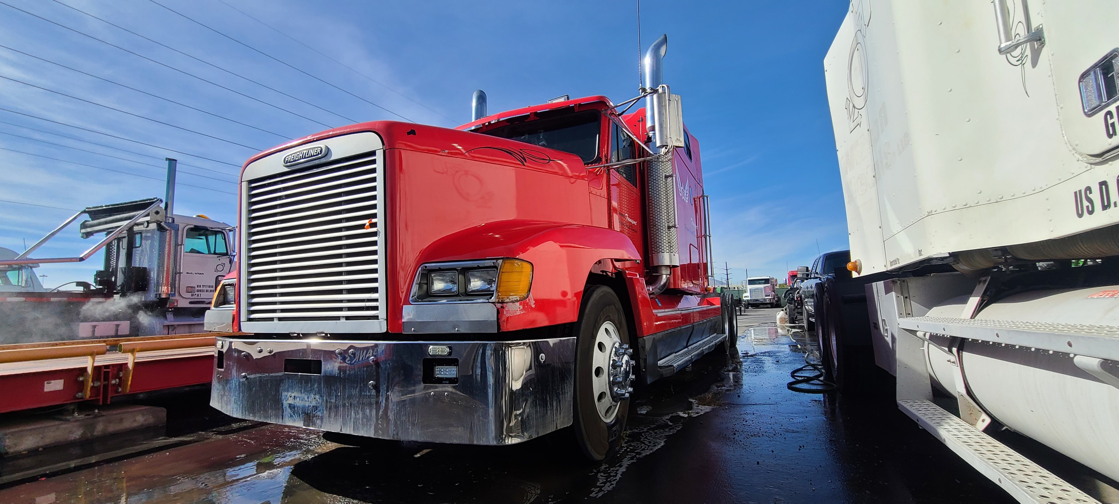 Red Freightliner FLD — chrome grille restored after commercial truck washing, Utah