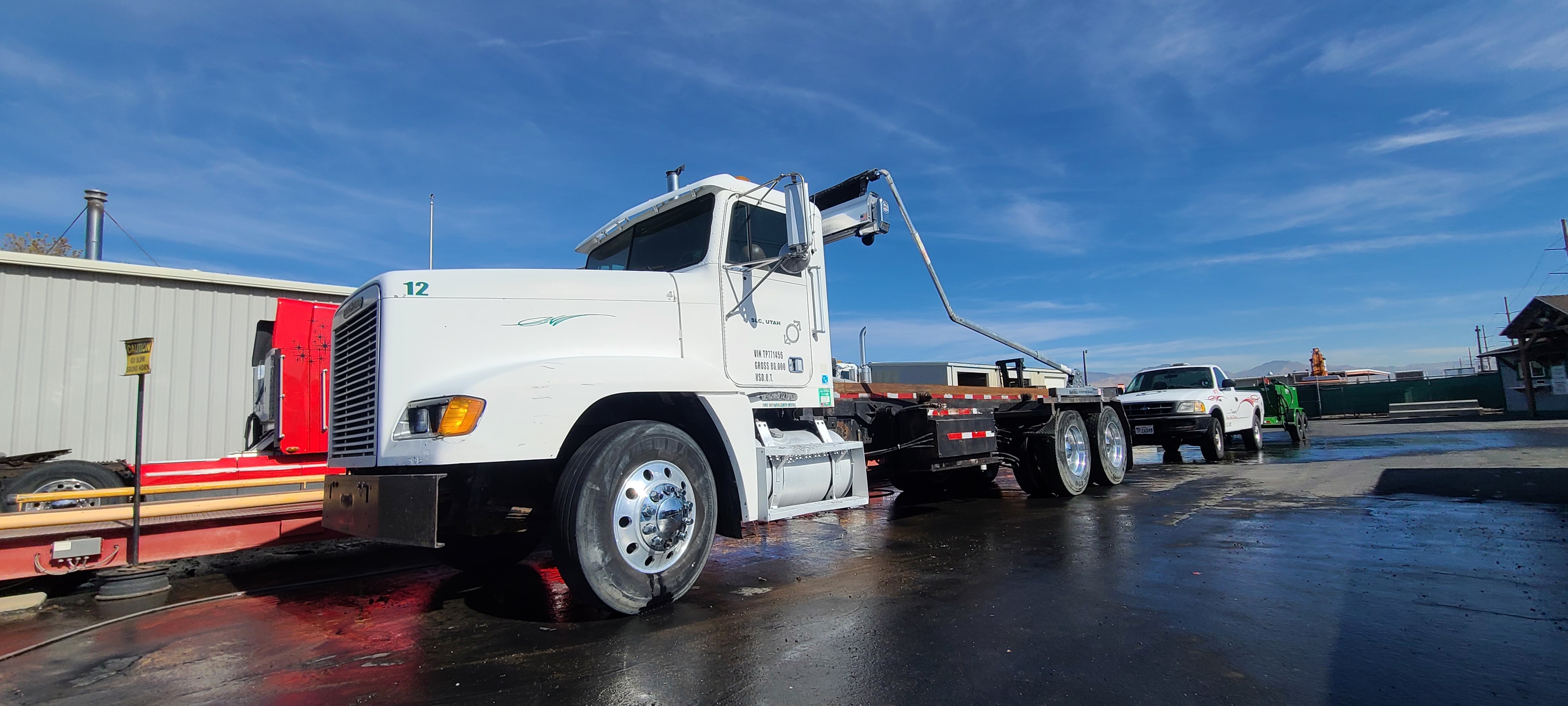 Freightliner 12 with knuckle boom crane — after commercial truck washing, Salt Lake City Utah