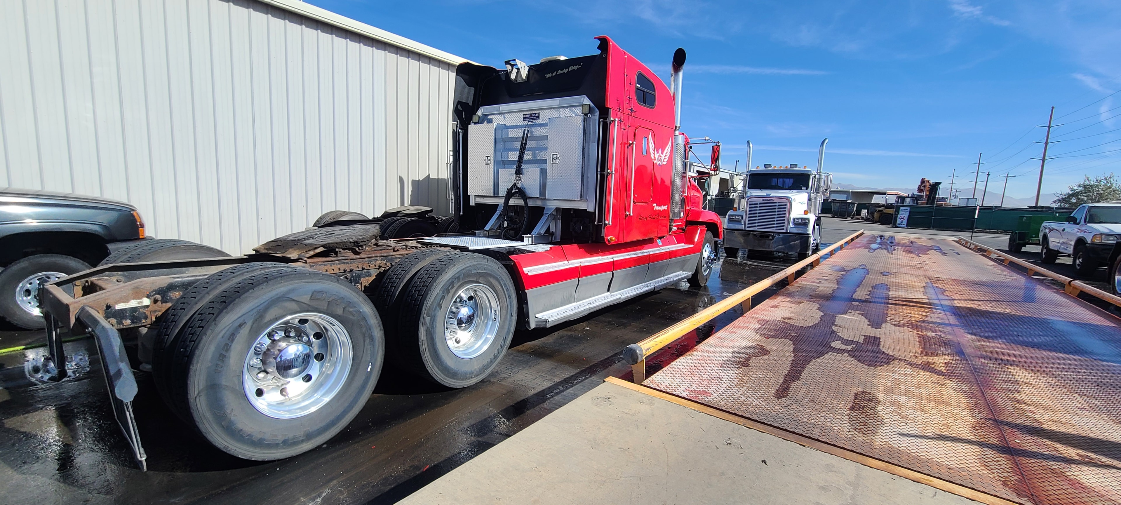 Red Western Star tractor — mirror-polished axle hubs after fleet washing, Salt Lake City Utah