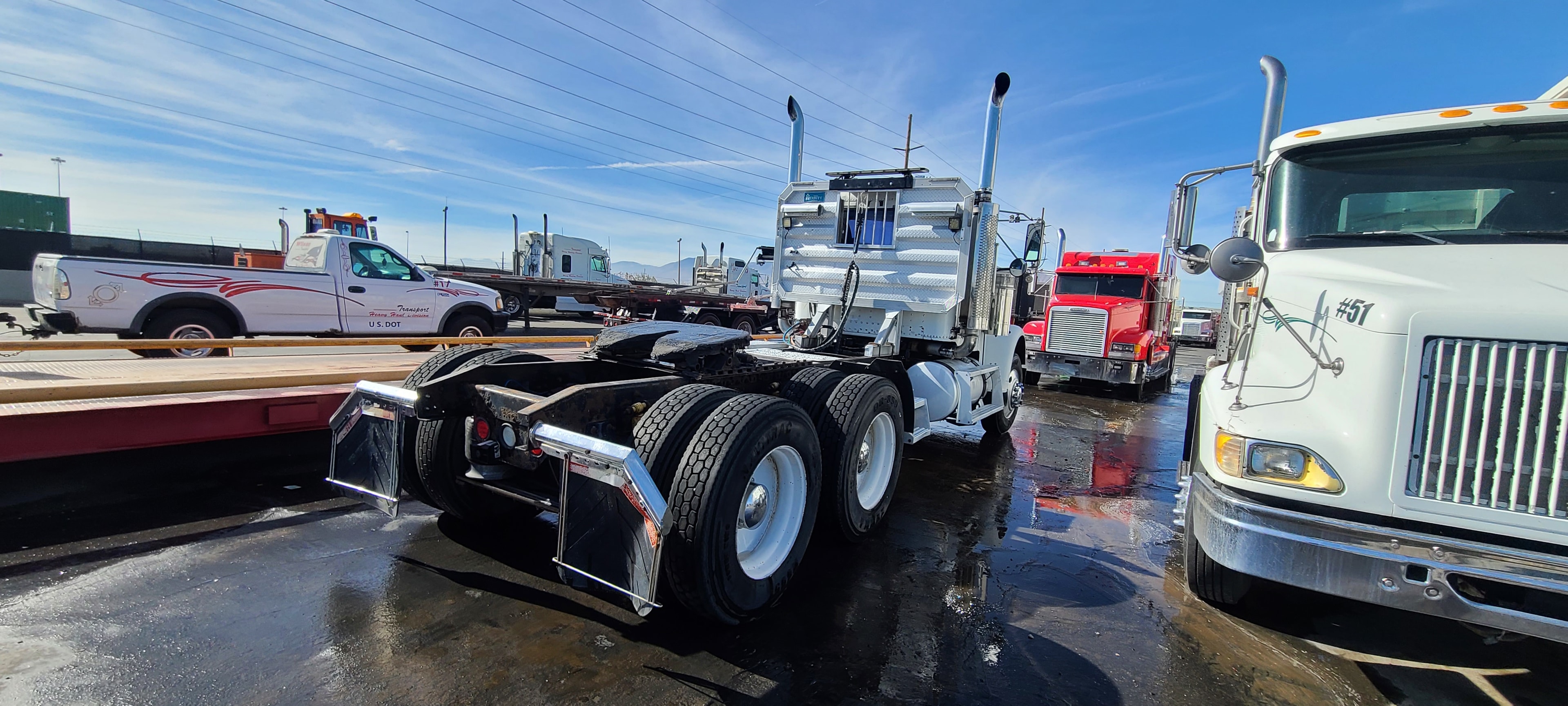 White Western Star bobtail rear — full yard view after fleet washing, Wilson Transport Salt Lake City
