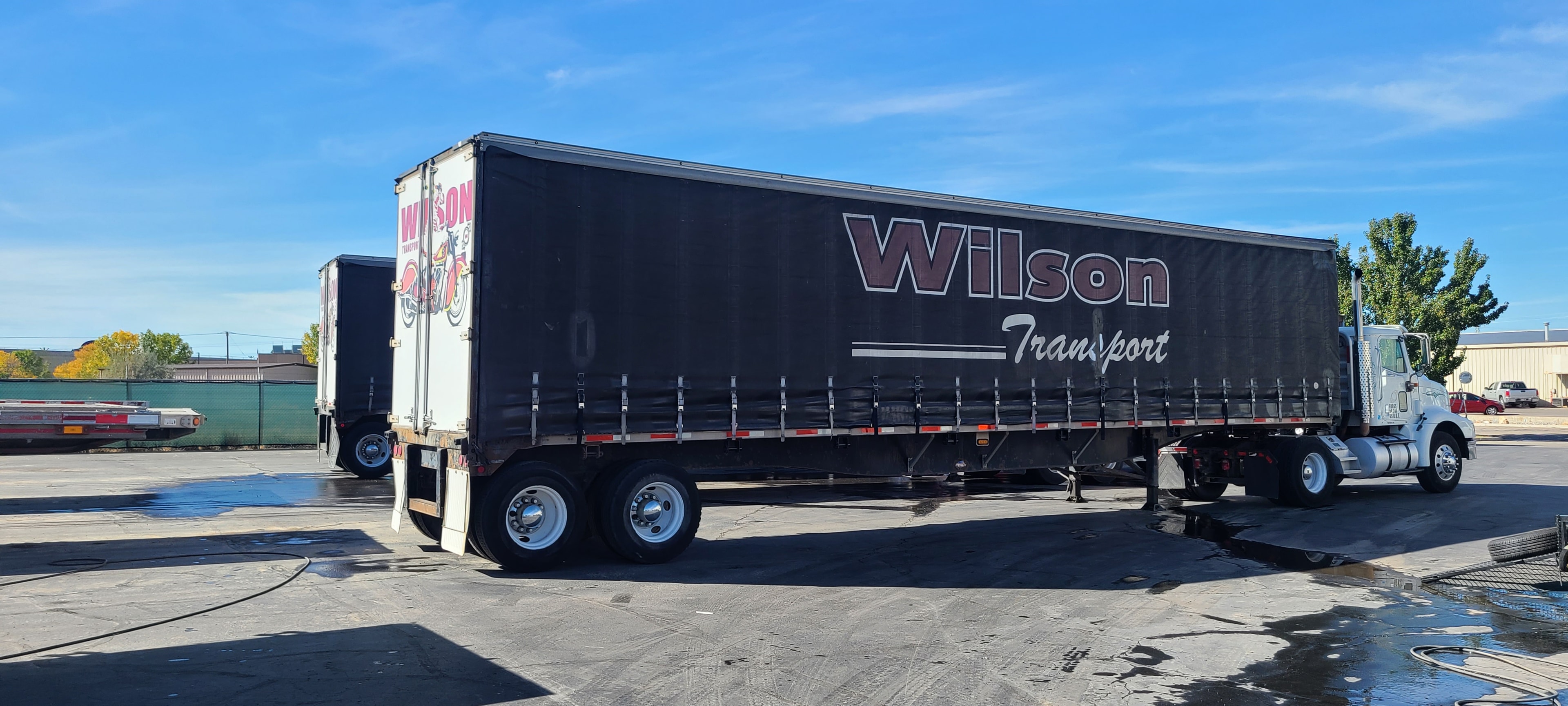 Wilson Transport curtain-side trailer — brand restored after commercial pressure washing, Utah