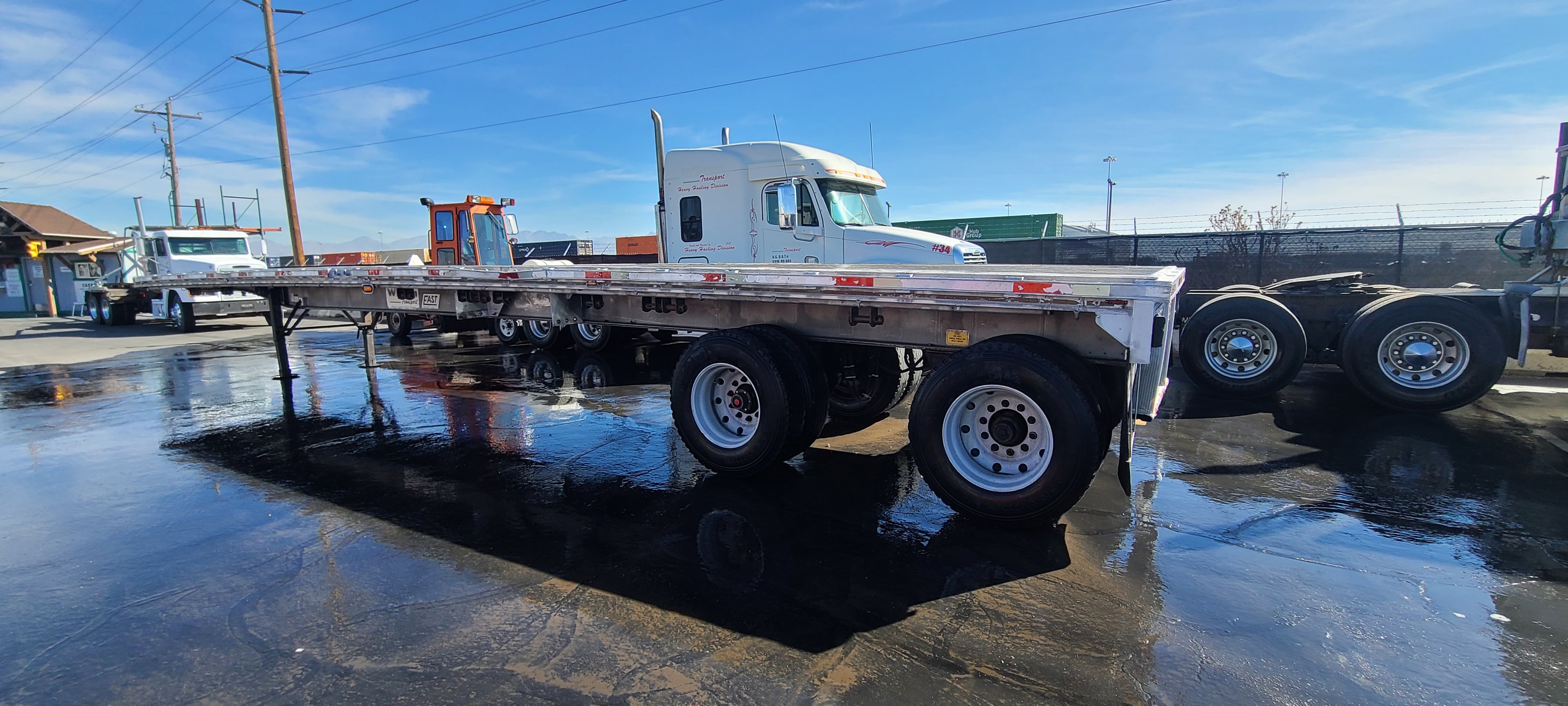 Wilson Transport Freightliner 34 with FAST flatbed trailer — after fleet washing, Salt Lake City