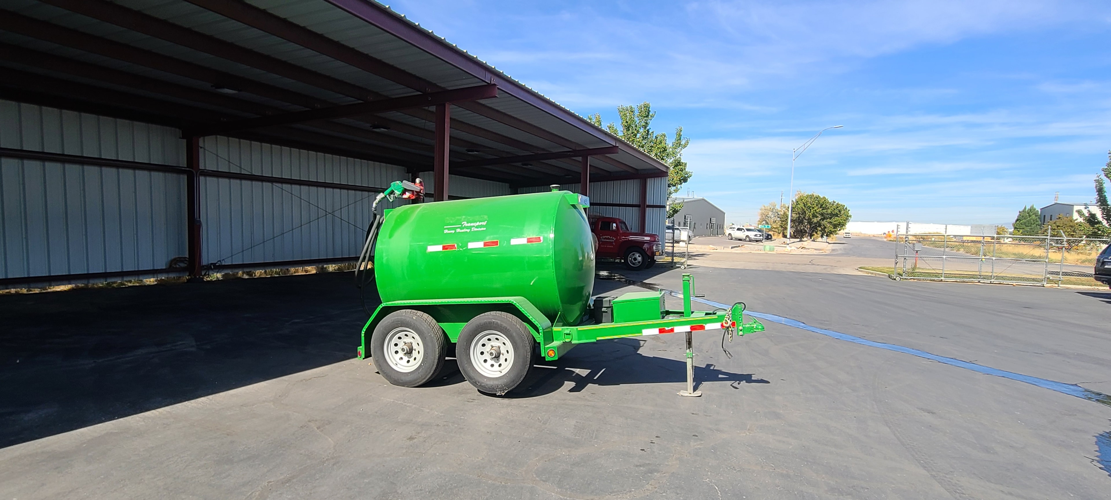 Wilson Transport green fuel trailer — petroleum residue before commercial washing, Utah