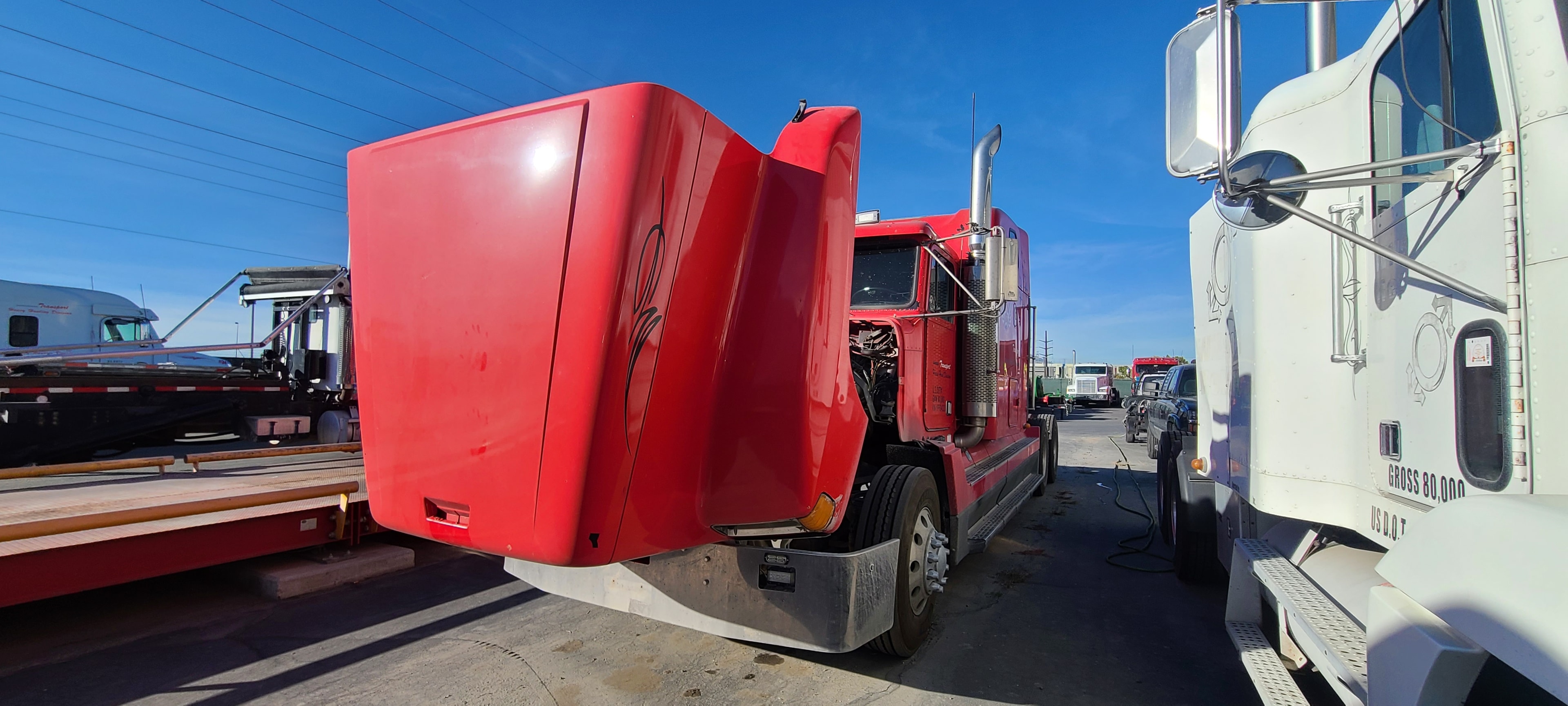 Red Kenworth semi truck — oxidized paint and road salt, Wilson Transport Utah