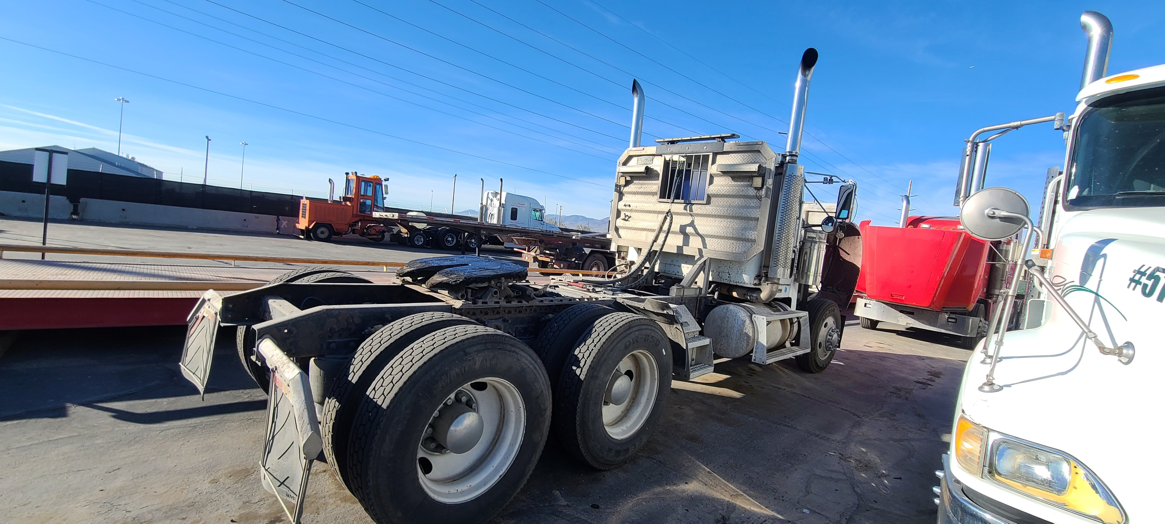 Semi truck rear axle — road grime and grease buildup, Salt Lake City fleet washing