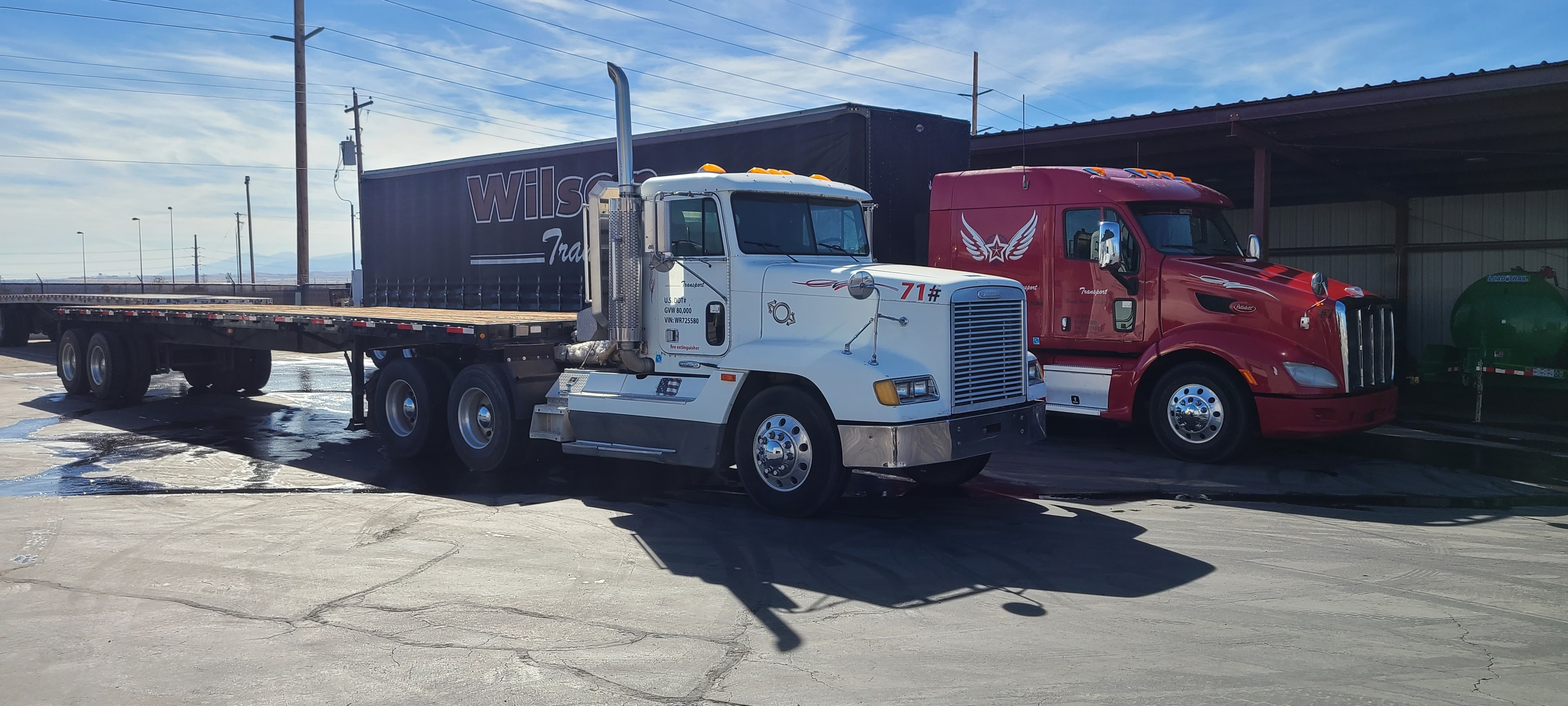 Wilson Transport fleet yard — multiple semi trucks before commercial washing, Salt Lake City